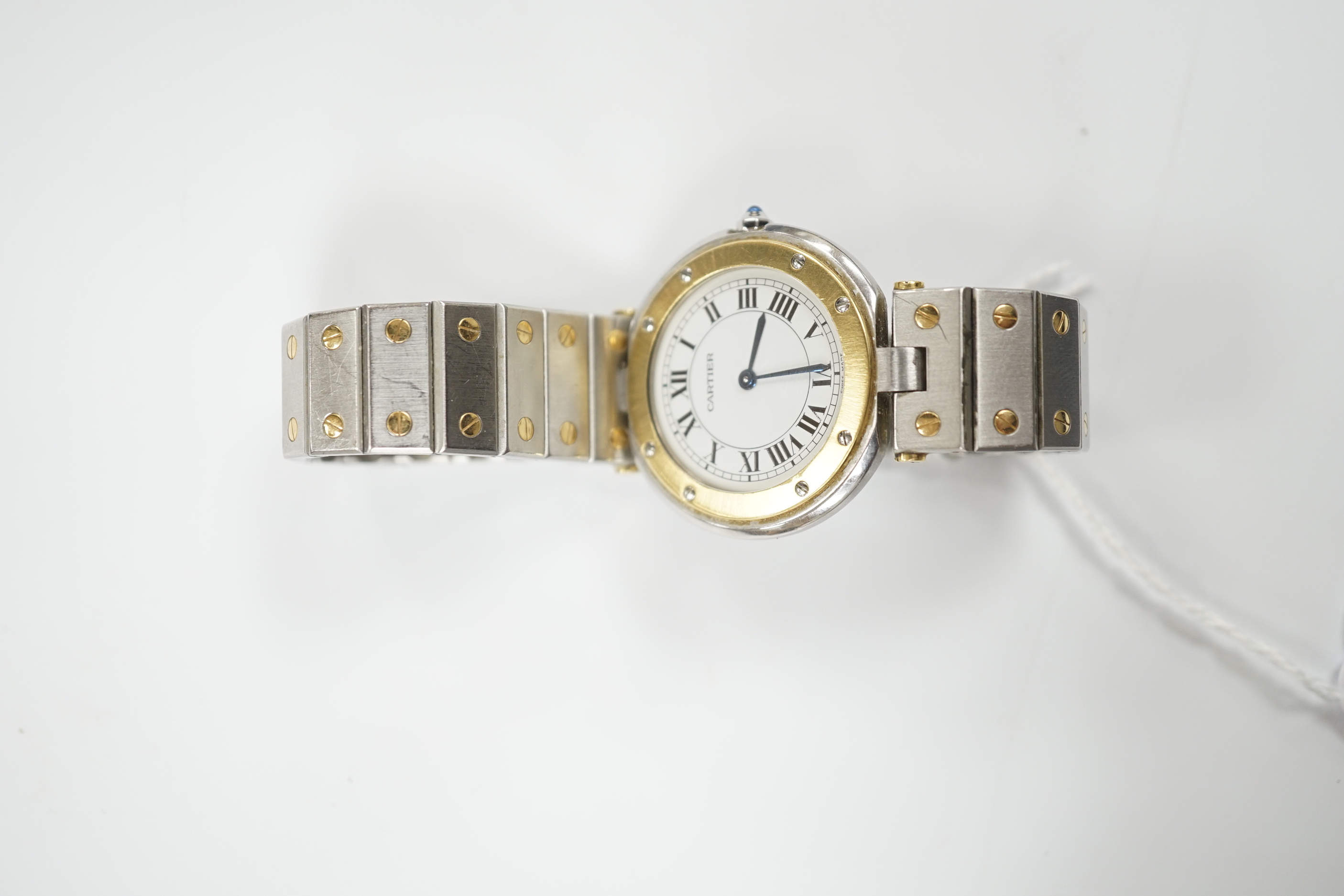 A steel and gold Cartier Ronde Vendom quartz wrist watch, with Roman dial, on a Cartier steel and gold bracelet, with Cartier pouch, no box or papers, case diameter 32mm.